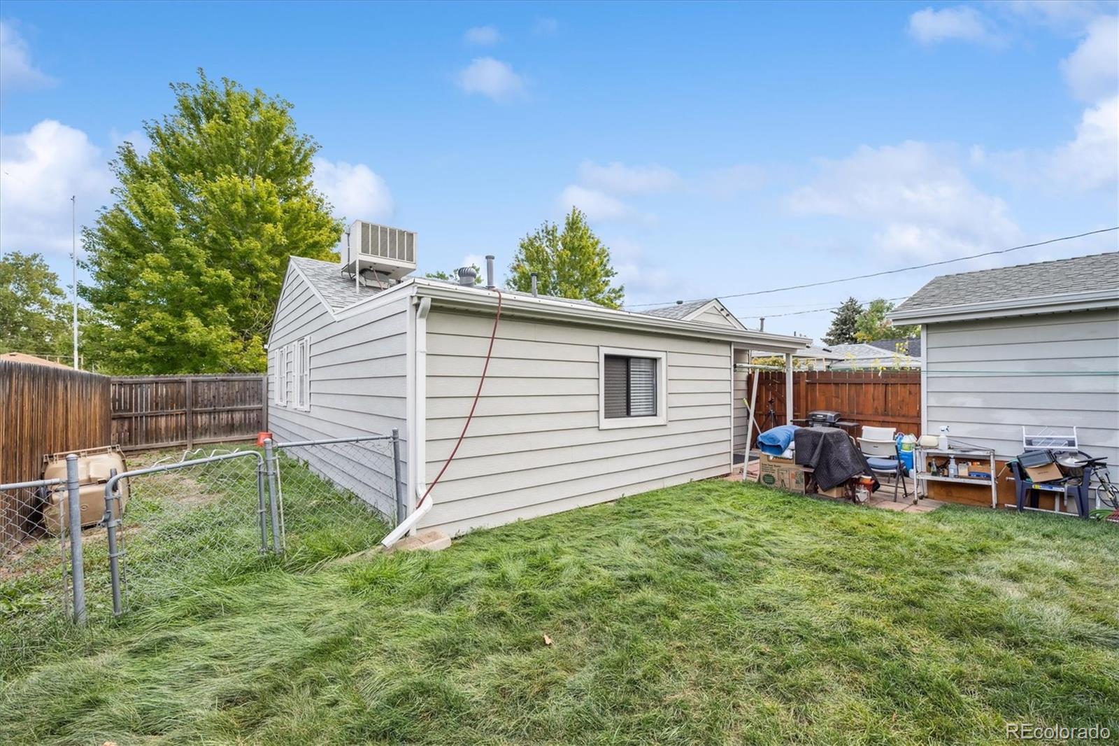 5465 Reed Court Arvada, CO 80002 - Photo 24 of 27 a view of a backyard with a sitting area