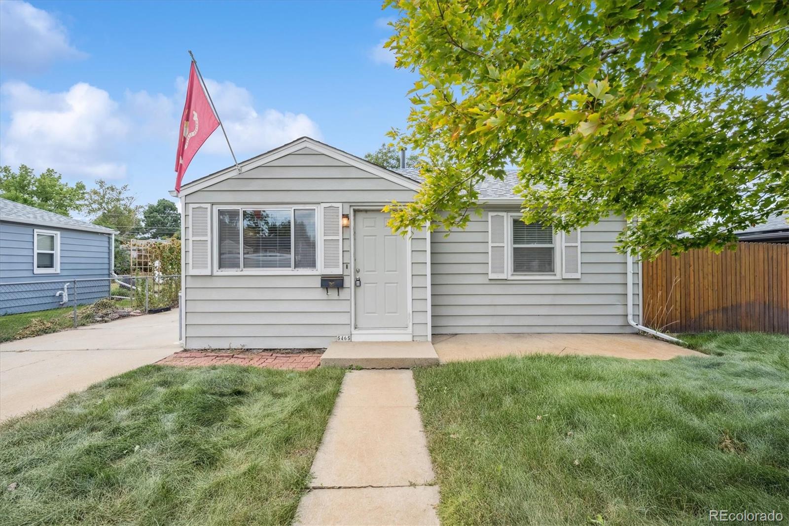5465 Reed Court Arvada, CO 80002 - Photo 3 of 27 a front view of a house with garden