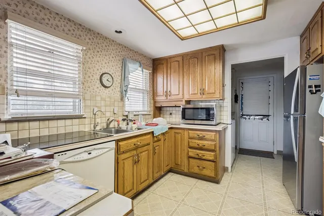 a kitchen with a sink cabinets and window