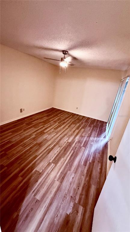 6519 West Newberry Road, Unit 206 Gainesville, FL 32605 - Photo 4 of 14 a view of a room with wooden floor