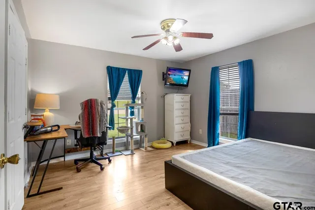 a bed room with a bed and a chandelier