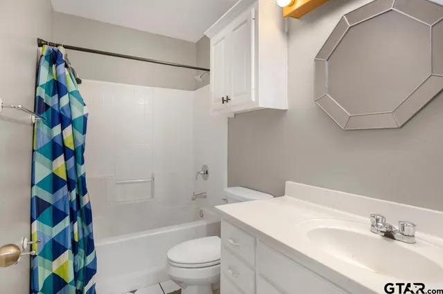a bathroom with a sink a toilet and a bathtub