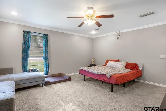 a bedroom with furniture and a window