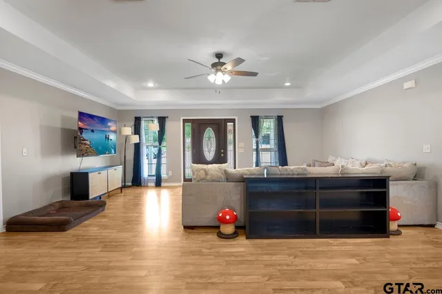a living room with furniture and a flat screen tv