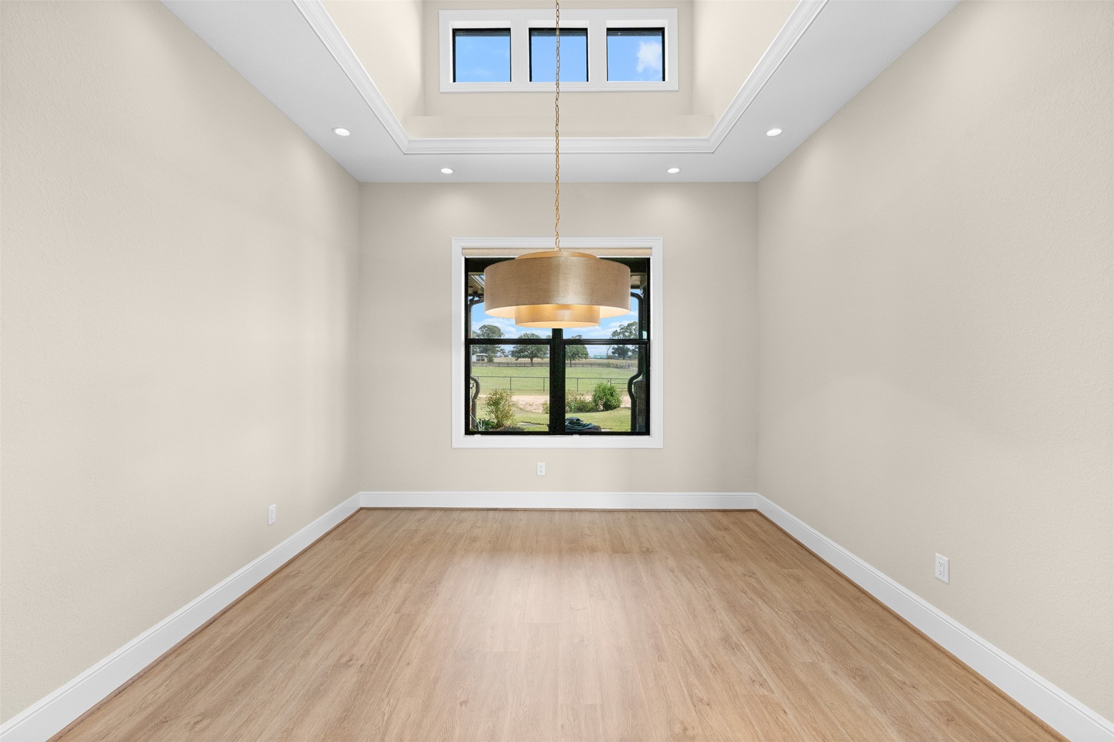 30163 High Spirit Ranch Road Hempstead, TX 77445 - Photo 15 of 46 Formal dining room space with high ceilings, custom lighting and thoughfully placed windows to add interest and light.