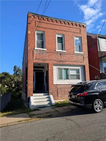 a car parked in front of a house