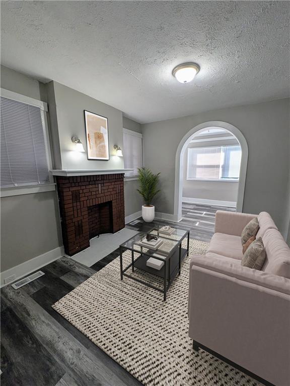 82 Harlem Avenue McKees Rocks, PA 15136 - Photo 5 of 27 a living room with furniture and a fireplace