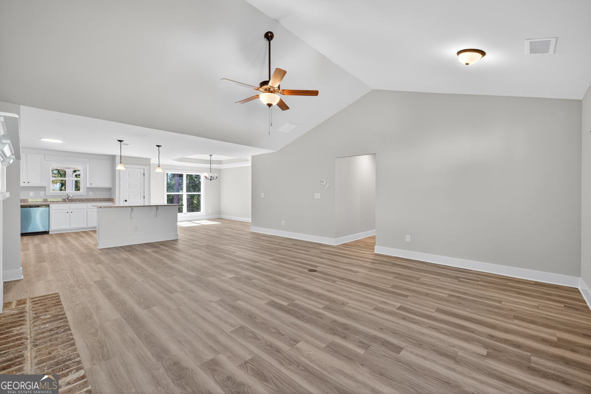 51 Brockton Way, Unit 2 Winder, GA 30680 - Photo 7 of 38 a view of empty room with wooden floor and ceiling fan