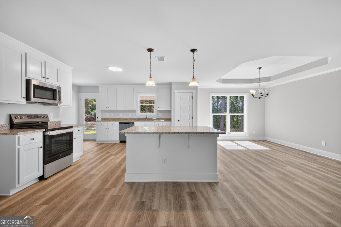 51 Brockton Way, Unit 2 Winder, GA 30680 - Photo 8 of 38 a kitchen with a sink window and stainless steel appliances
