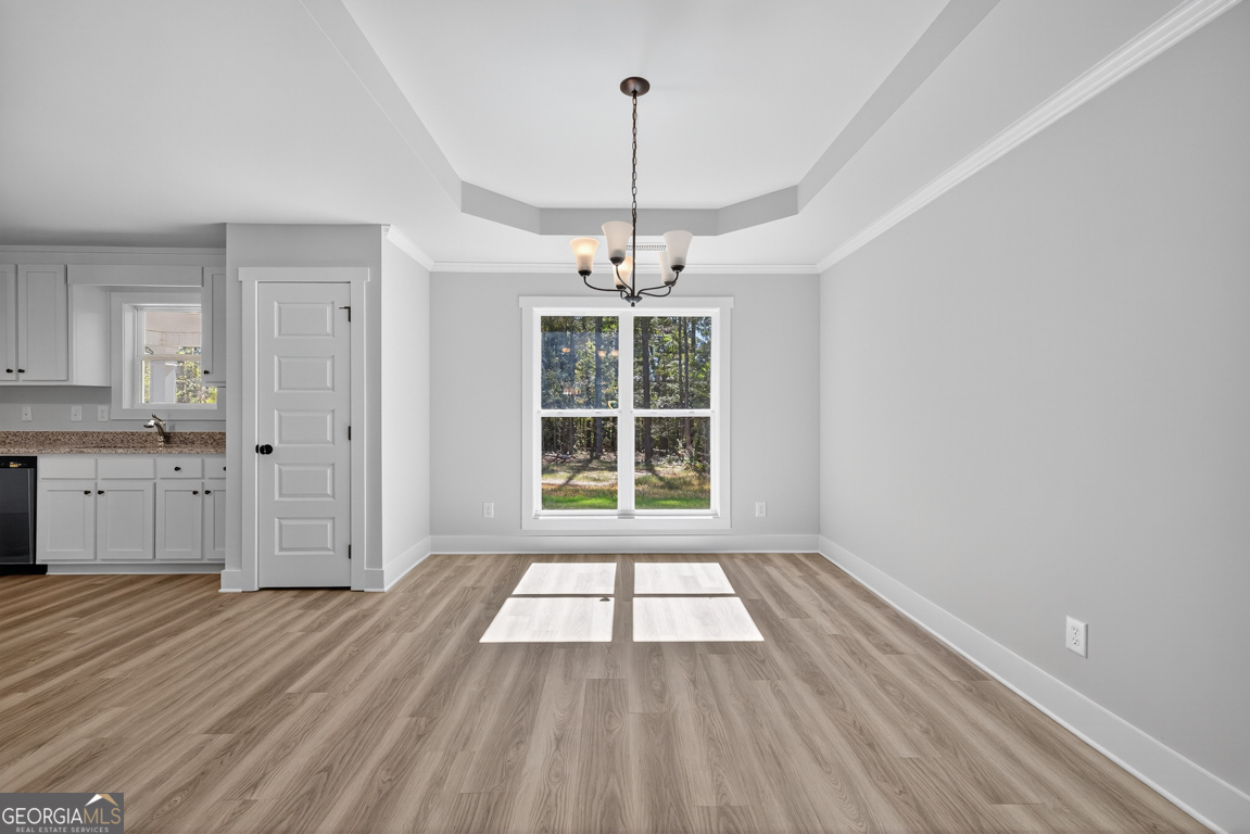 51 Brockton Way, Unit 2 Winder, GA 30680 - Photo 10 of 38 a view of a room with window wooden floor and front door