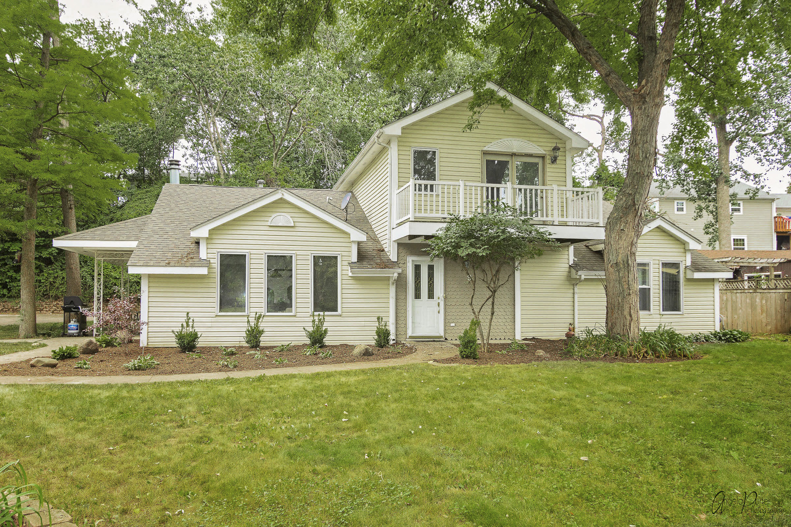 a front view of a house with a yard