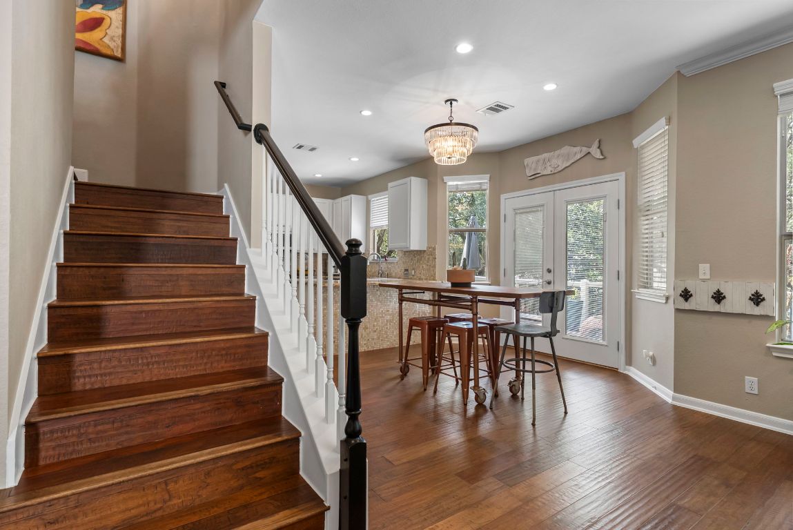 4104 Seldalia Trail Austin, TX 78732 - Photo 14 of 40 a view of a dining room with furniture and wooden floor