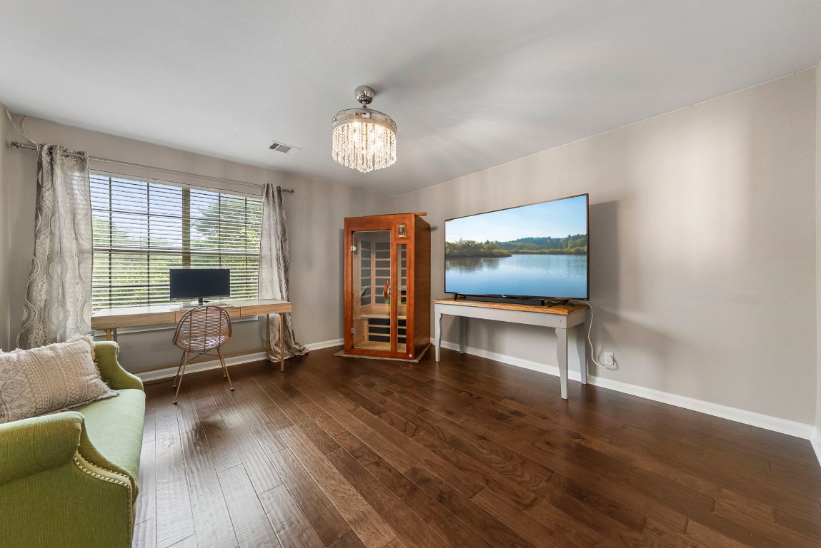 4104 Seldalia Trail Austin, TX 78732 - Photo 26 of 40 a living room with furniture and a wooden floor