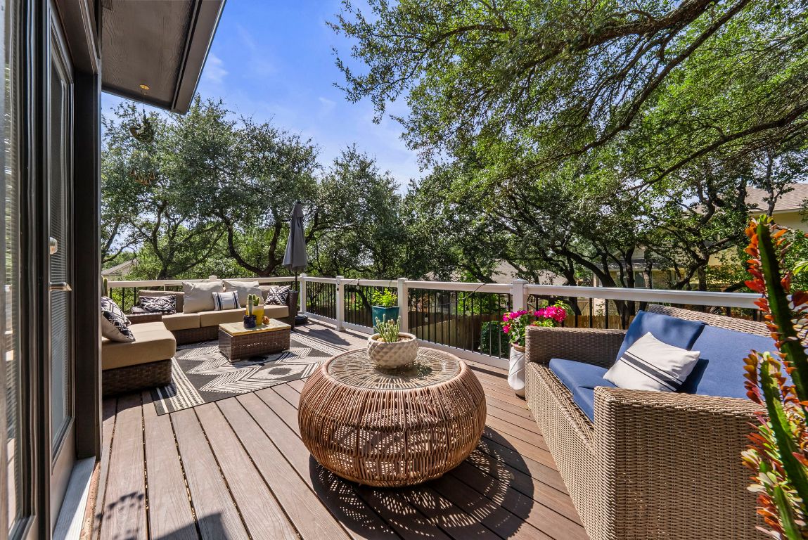 4104 Seldalia Trail Austin, TX 78732 - Photo 31 of 40 a balcony with wooden benches and outdoor seating