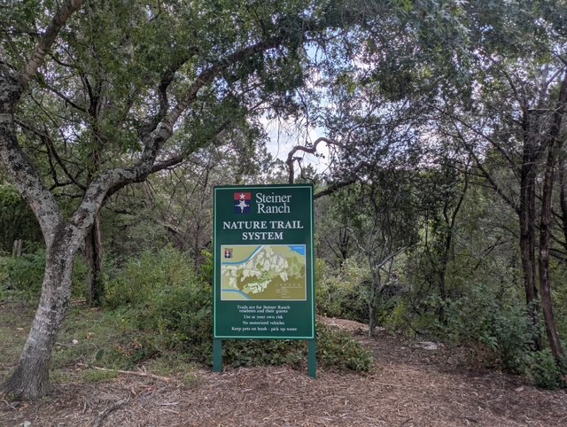 4104 Seldalia Trail Austin, TX 78732 - Photo 36 of 40 a sign that is sitting on a rock