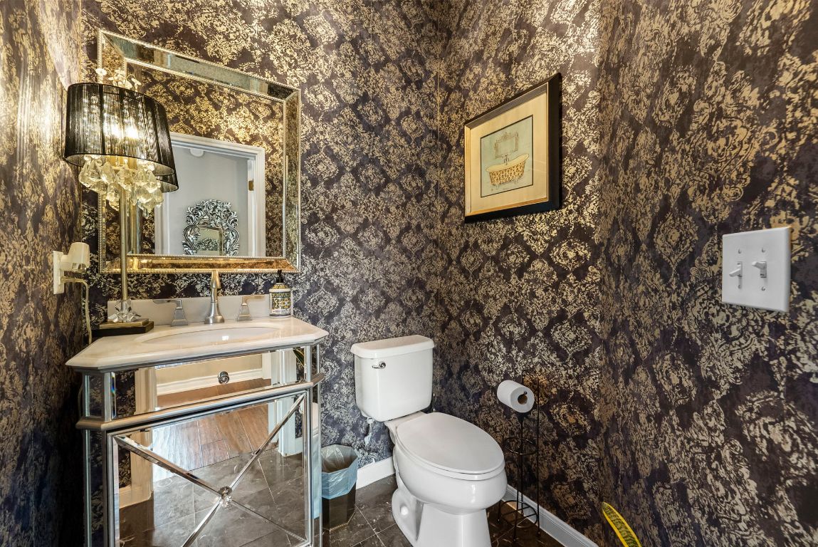 4104 Seldalia Trail Austin, TX 78732 - Photo 5 of 40 a white toilet sitting next to a bathroom sink