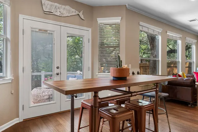 a dining room with furniture and window