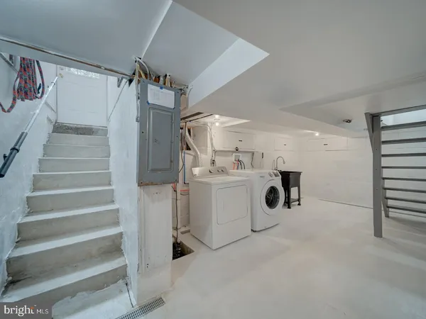 a view of a storage & utility room with washer and dryer