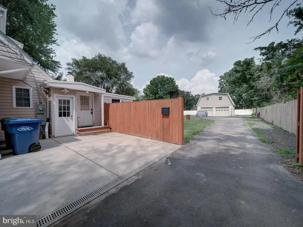 a backyard of a house with yard and garage