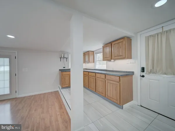 a kitchen with cabinets and oven