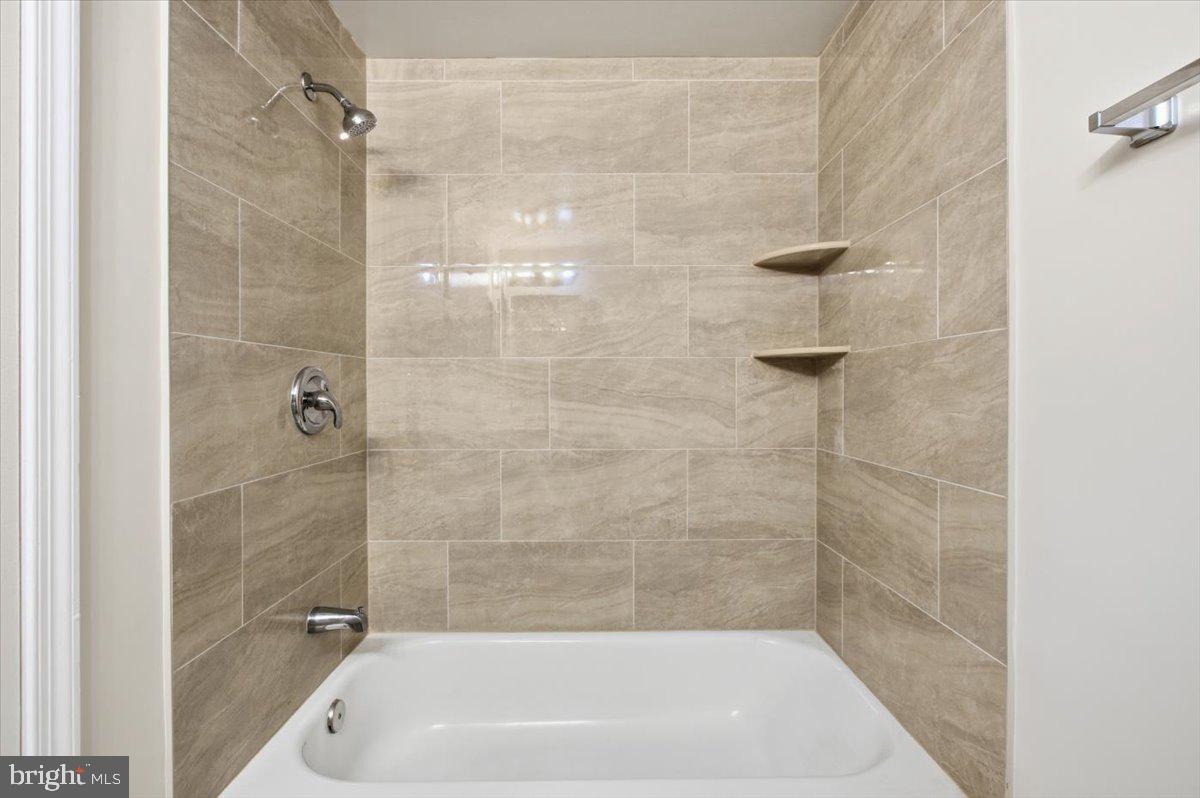 Margate Court, Unit A Sterling, VA 20164 - Photo 13 of 20 a bathroom with a shower and a bath tub