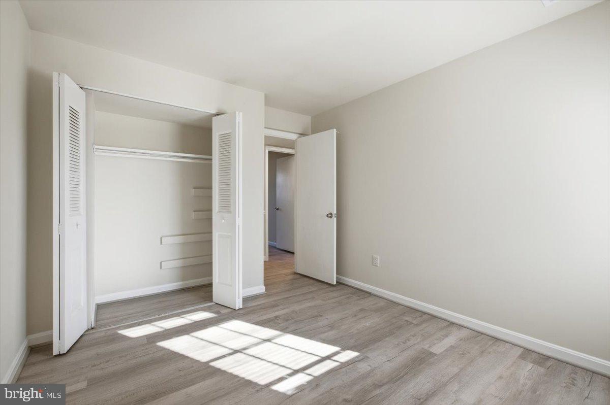Margate Court, Unit A Sterling, VA 20164 - Photo 15 of 20 an empty room with an entryway and window