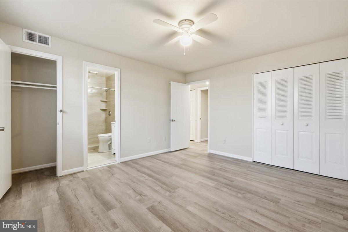 Margate Court, Unit A Sterling, VA 20164 - Photo 17 of 20 a view of empty room with wooden floor and fan