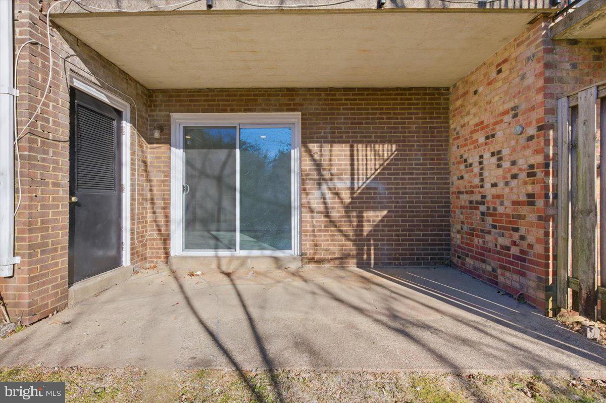 Margate Court, Unit A Sterling, VA 20164 - Photo 20 of 20 a view of a brick house with an outdoor space