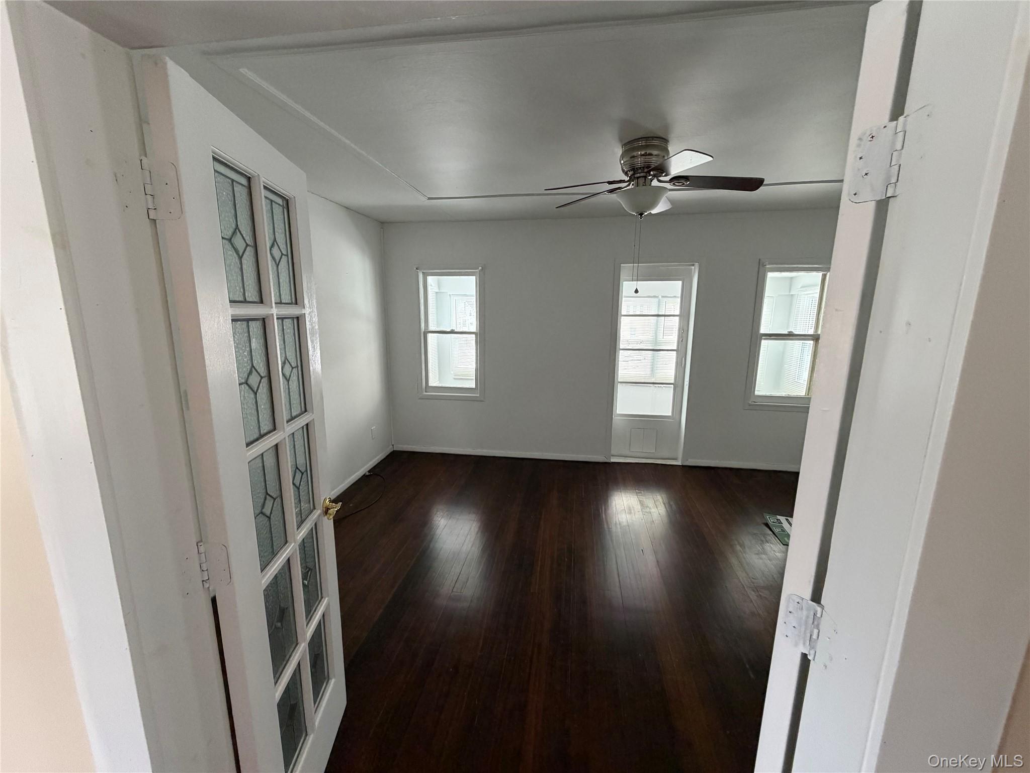 32 Fountain Place, Unit 2 Poughkeepsie, NY 12603 - Photo 5 of 20 wooden floor in an empty room with a window