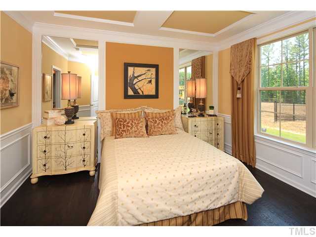 7320 Caversham Way, Unit 72 Raleigh, NC 27617 - Photo 5 of 8 a bedroom with a bed and a large window