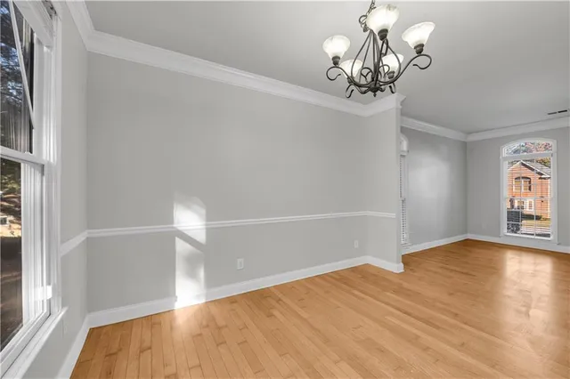 a view of a livingroom with wooden floor