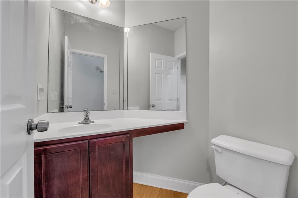 1427 Lost Bridge Road Southwest Marietta, GA 30008 - Photo 17 of 50 a bathroom with a granite countertop sink and a mirror
