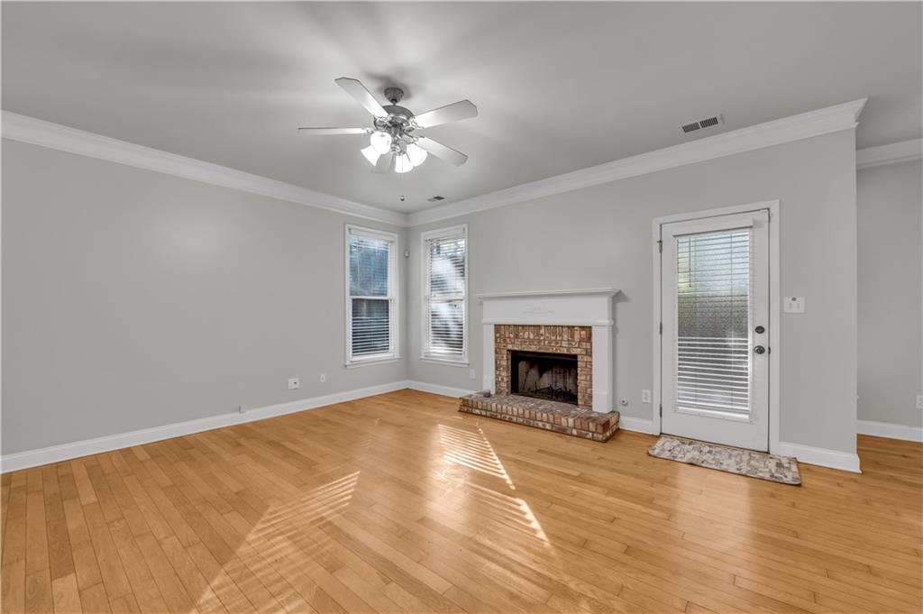1427 Lost Bridge Road Southwest Marietta, GA 30008 - Photo 21 of 50 a view of empty room with fireplace and wooden floor
