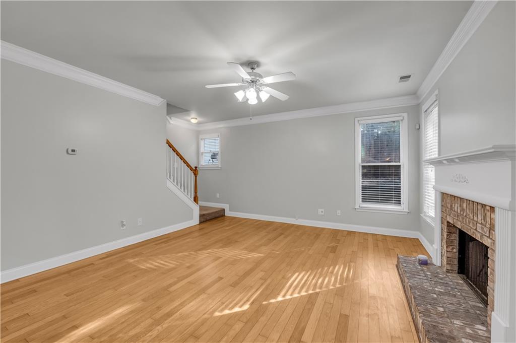 1427 Lost Bridge Road Southwest Marietta, GA 30008 - Photo 22 of 50 a view of empty room with wooden floor and fan