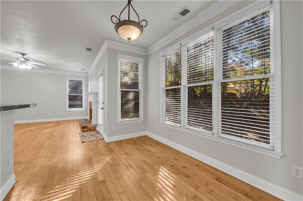 1427 Lost Bridge Road Southwest Marietta, GA 30008 - Photo 27 of 50 a view of an empty room with a window and chandelier