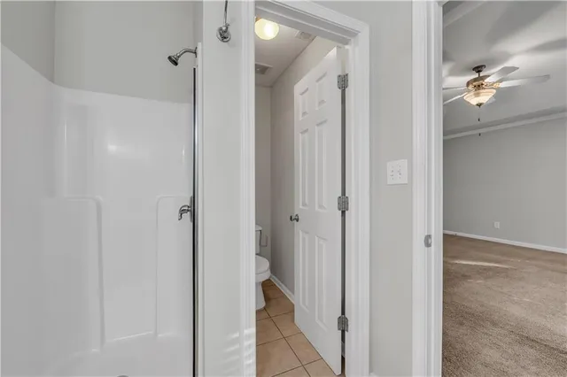 a view of a bathroom from a hallway