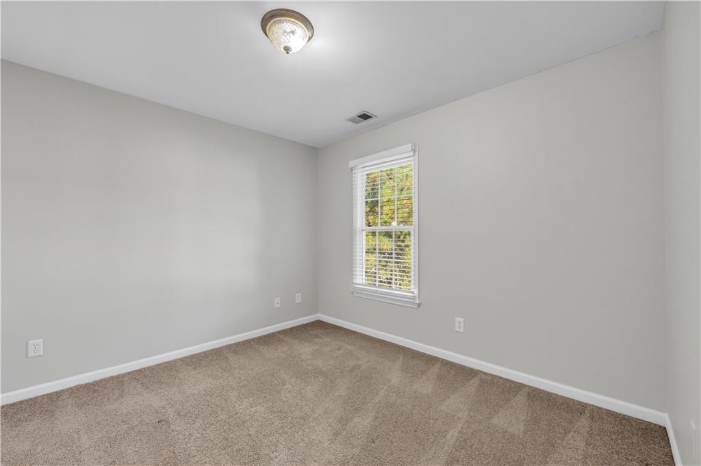 1427 Lost Bridge Road Southwest Marietta, GA 30008 - Photo 40 of 50 an empty room with a window
