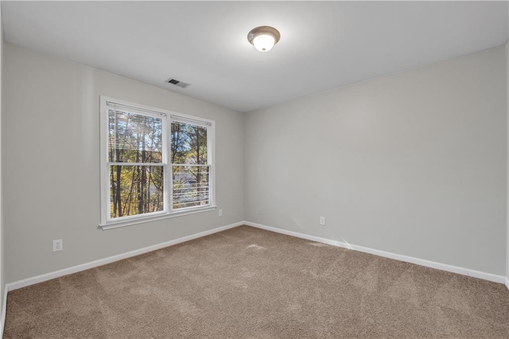 1427 Lost Bridge Road Southwest Marietta, GA 30008 - Photo 43 of 50 an empty room with a window