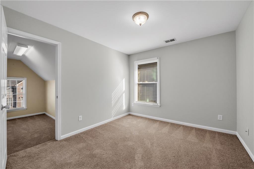 1427 Lost Bridge Road Southwest Marietta, GA 30008 - Photo 46 of 50 an empty room with windows