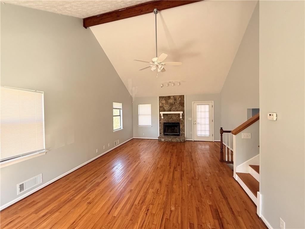 20 West Forest Drive Covington, GA 30016 - Photo 2 of 5 a view of empty room with wooden floor and fan