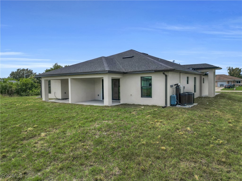 2508-2510 Park Road Lehigh Acres, FL 33971 - Photo 33 of 37 a view of a house with a backyard