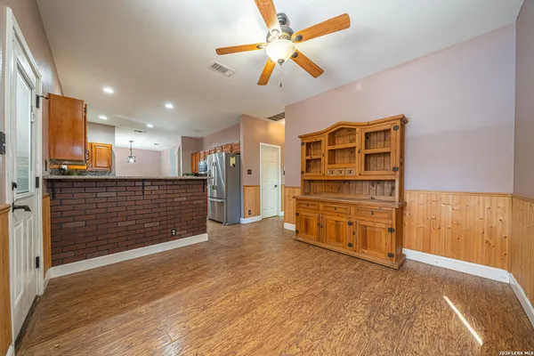 a view of a hallway with a kitchen