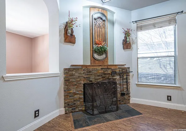 a living room with furniture and a fireplace