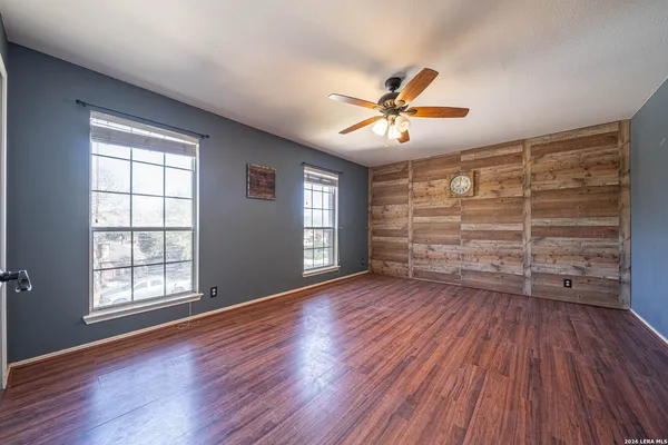 wooden floor in an empty room with a window