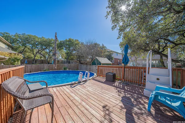 a view of a backyard with sitting area