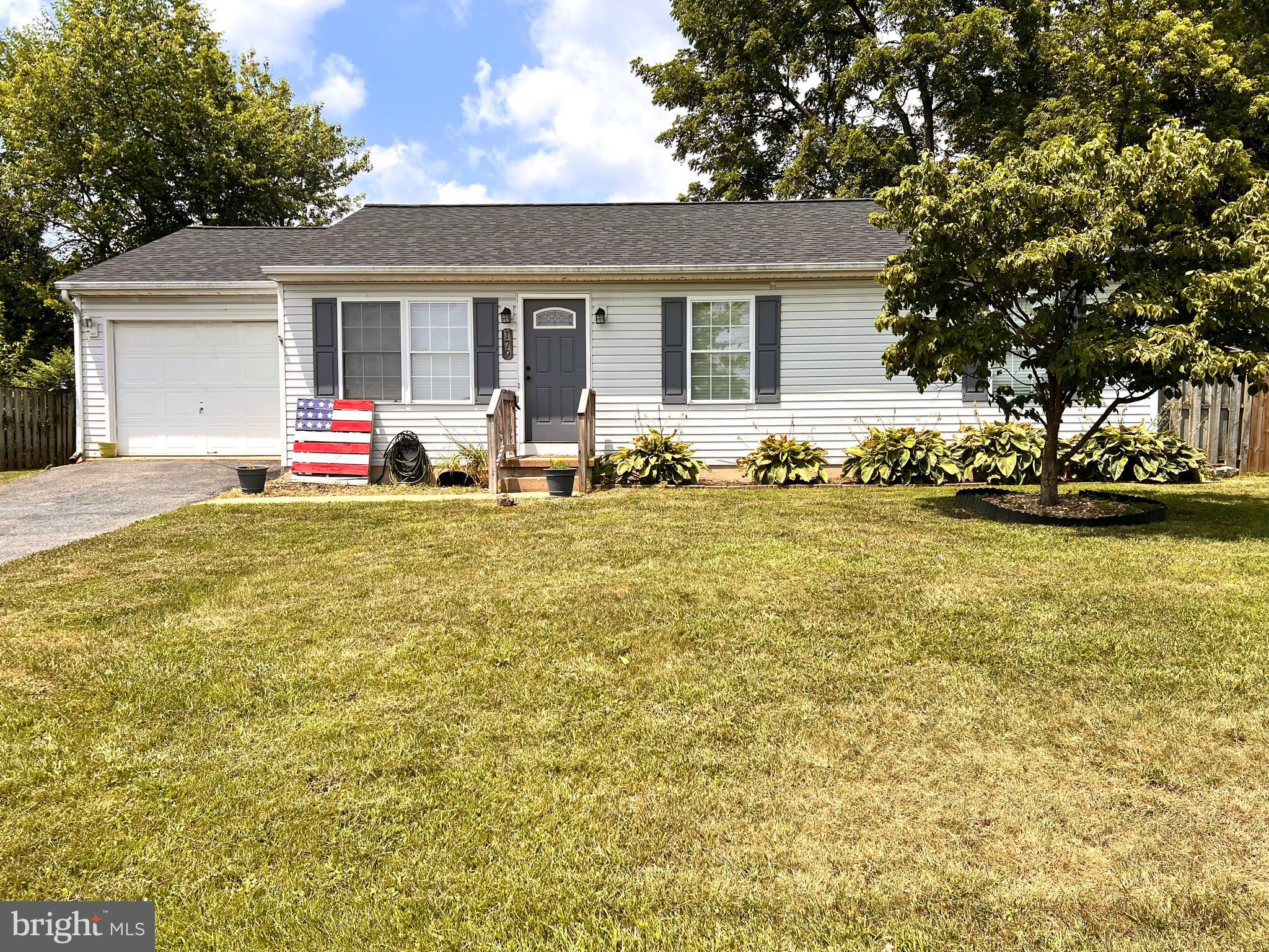 179 Robelei Drive Ranson, WV 25438 - Photo 2 of 17 a house that has a tree in front of it