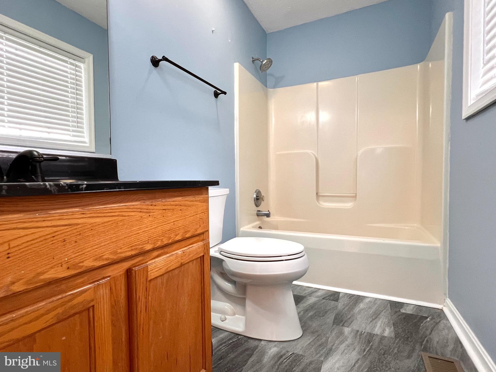 179 Robelei Drive Ranson, WV 25438 - Photo 10 of 17 a bathroom with a sink a toilet and a bathtub