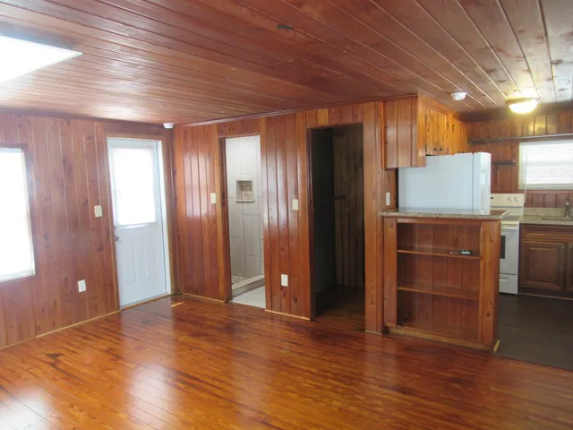 a kitchen with a refrigerator sink and window