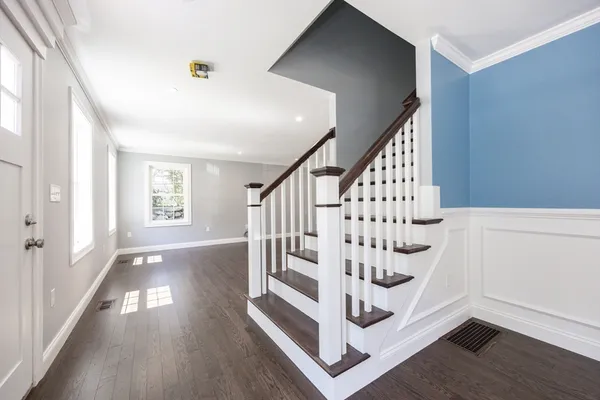 a view of entryway with wooden floor