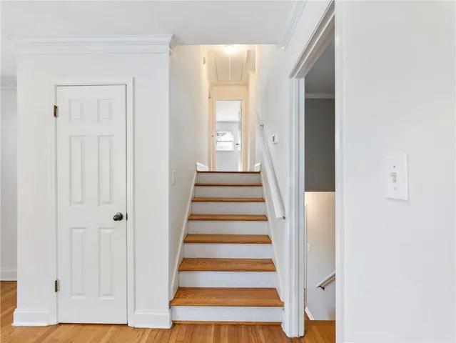 a view of an entryway with wooden floor